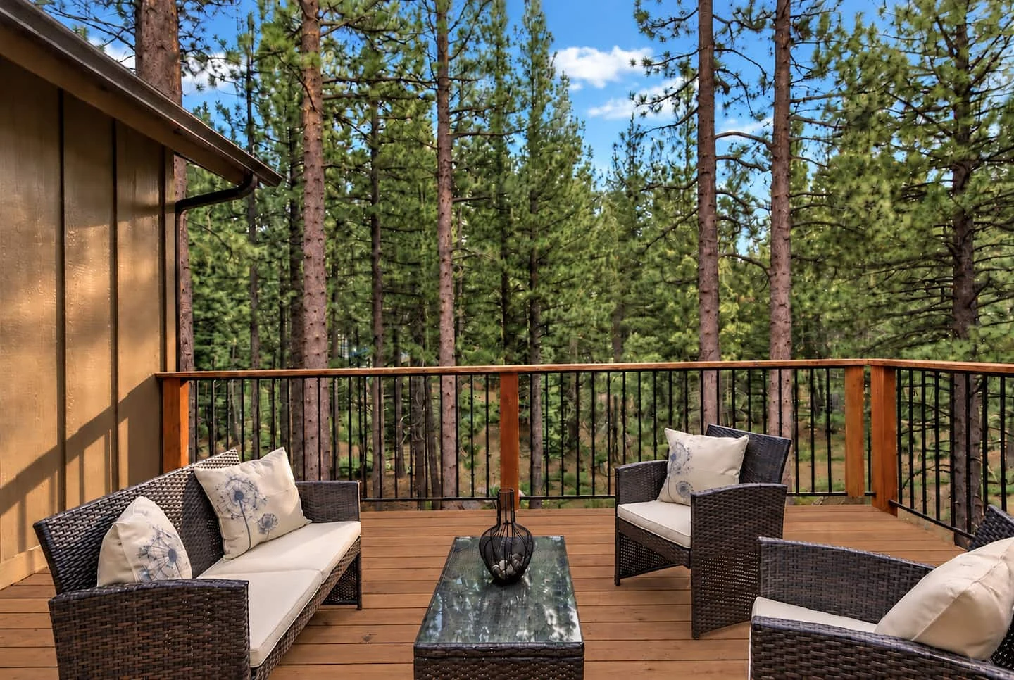 Lounge seating on the deck with a view into the pine forest